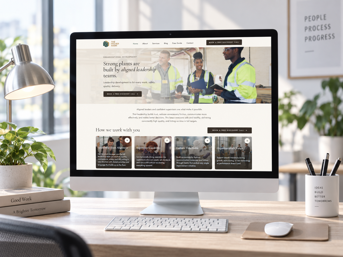 The Higher Mark · Marketing & Consulting website mockup shown on a laptop and phone